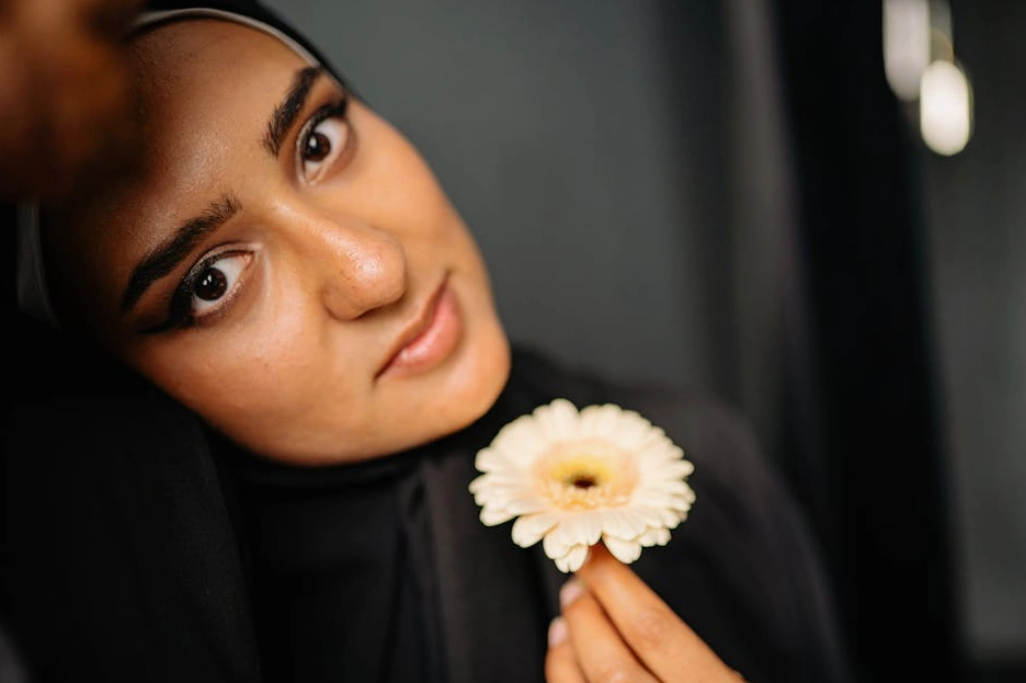 A collage of cultural and scientific images: a museum gallery, a researcher in a lab, and a community event.